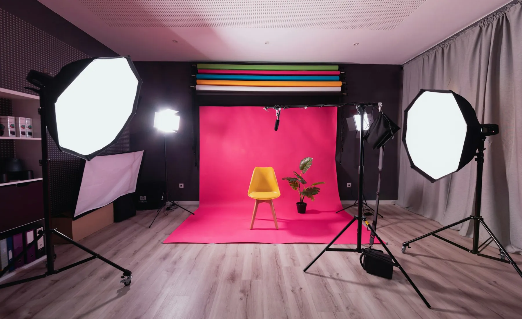 A bright pink studio set with softboxes